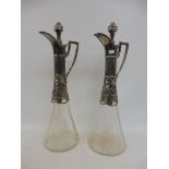 A good pair of Art Nouveau WMF decanters with well detailed grape and vine designed mounts, with