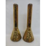 A pair of Arts and Crafts WMF brass hexagonal tall vases with three embossed floral panels stamped