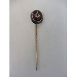 A gold mounted Masonic stick pin.