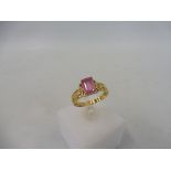 An 18ct gold hot pink stone gold ring.