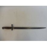 A WWII bayonet by Wilkinson Sword Company London, stamped 49W, War Dept. in leather and steel