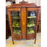 An Edwardian Sheraton Revival mahogany and satinwood inlaid display cabinet of two curved doors