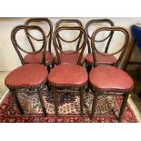 A set of six Thonet bentwood chairs with rexine covered seats.