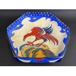 An early 20th Century hexagonal bowl decorated with a red bird of prey/mythical creature, marked