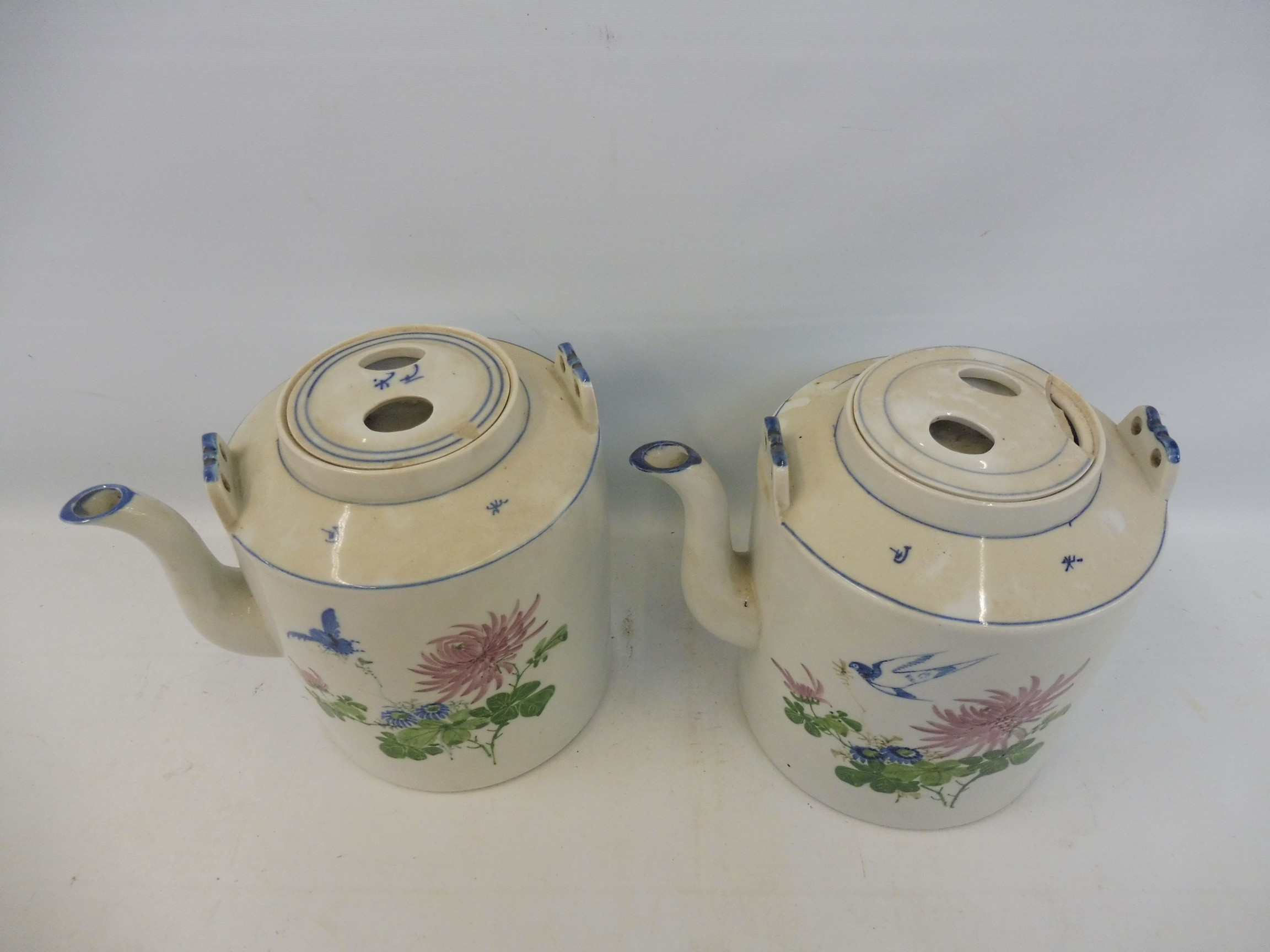 A pair of Chinese Canton teapots decorated with flowers and birds in flight, 7 3/4" high. - Image 2 of 4