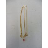 An 18ct gold hot pink stone pendant.