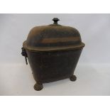A 19th Century toleware coal scuttle raised upon stylised paw supports.