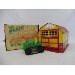 A 1960s American plastic barn and tractor, boxed.