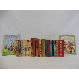 A tray of assorted volumes of Enid Blyton's Famous Five, three early releases with dust jackets to