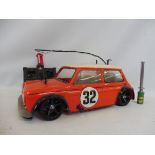 A Tamiya Mk. I Mini Cooper 2003 racing car fitted with a nitro engine complete with a rip max Futaba