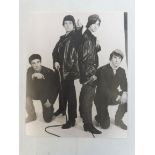 An original David Redfern photograph - image of the Kinks from the 1960s, with acreditation label to