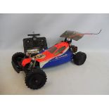 A Schumacher 1/10 radio controlled car with race craft body.