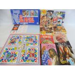 A selection of Six Million Dollar man, games, jigsaws and annuals.