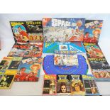 A collection of Space 1999 items including a game by Omnia, jigsaw, annuals and books.