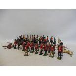 A tray of Britains playworn household cavalry plus a collection of standing bandsmen etc.
