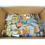 A huge collection of unsorted Pokemon cards, diferent series', some in protective wallets.