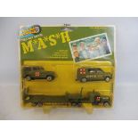 A carded MASH die-cast gift set, made by Rough Wheels.