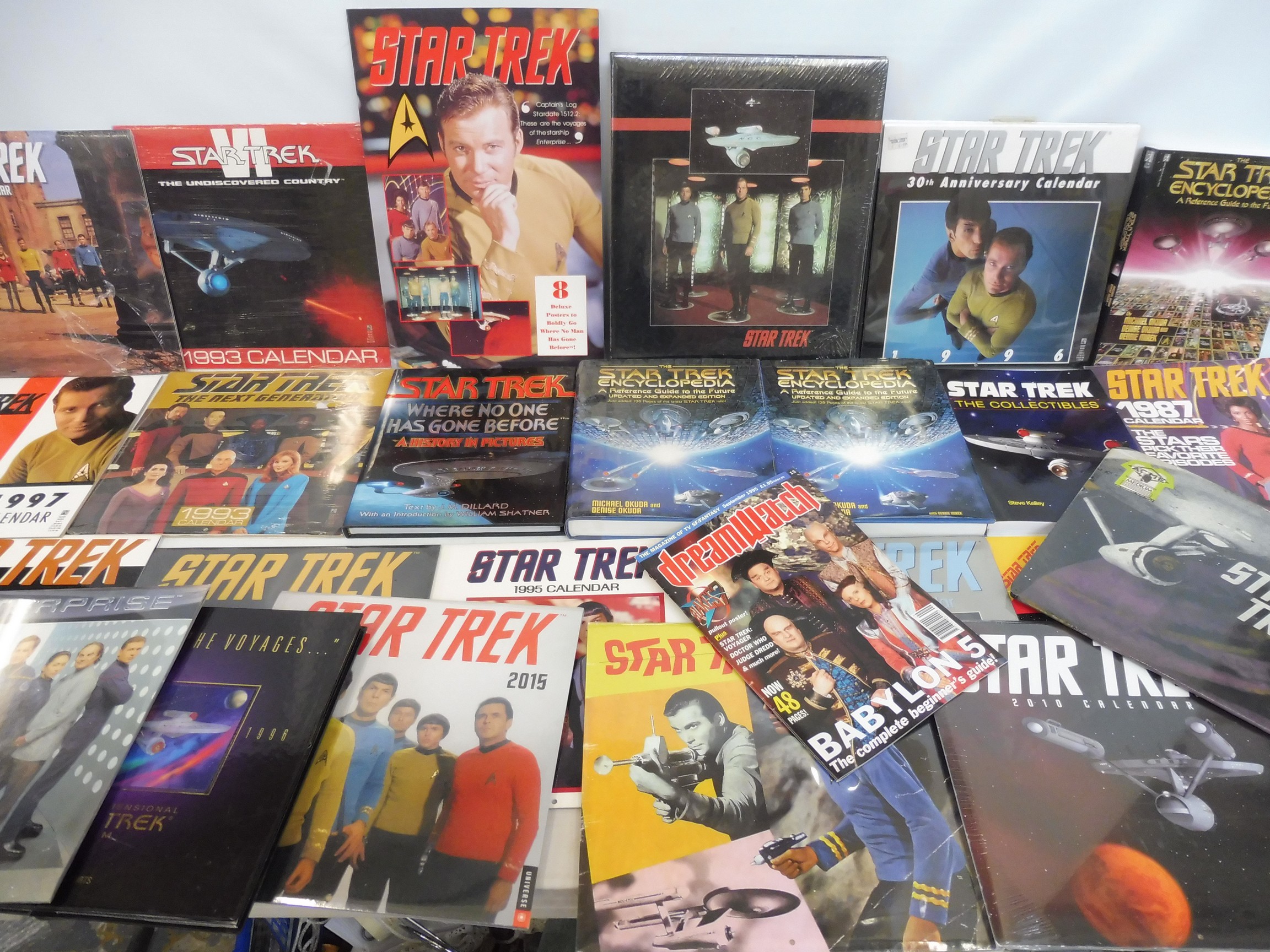 A box of Star Trek merchandise, books etc.,