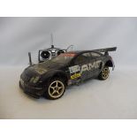 A Kyosho Pure 10GP with a Nitro GX/15 4WD, ACOMS controller, battery charger etc.