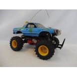 A Tamiya original Subaru, the body on a 4WD 1/10, Monster Truck Classic.