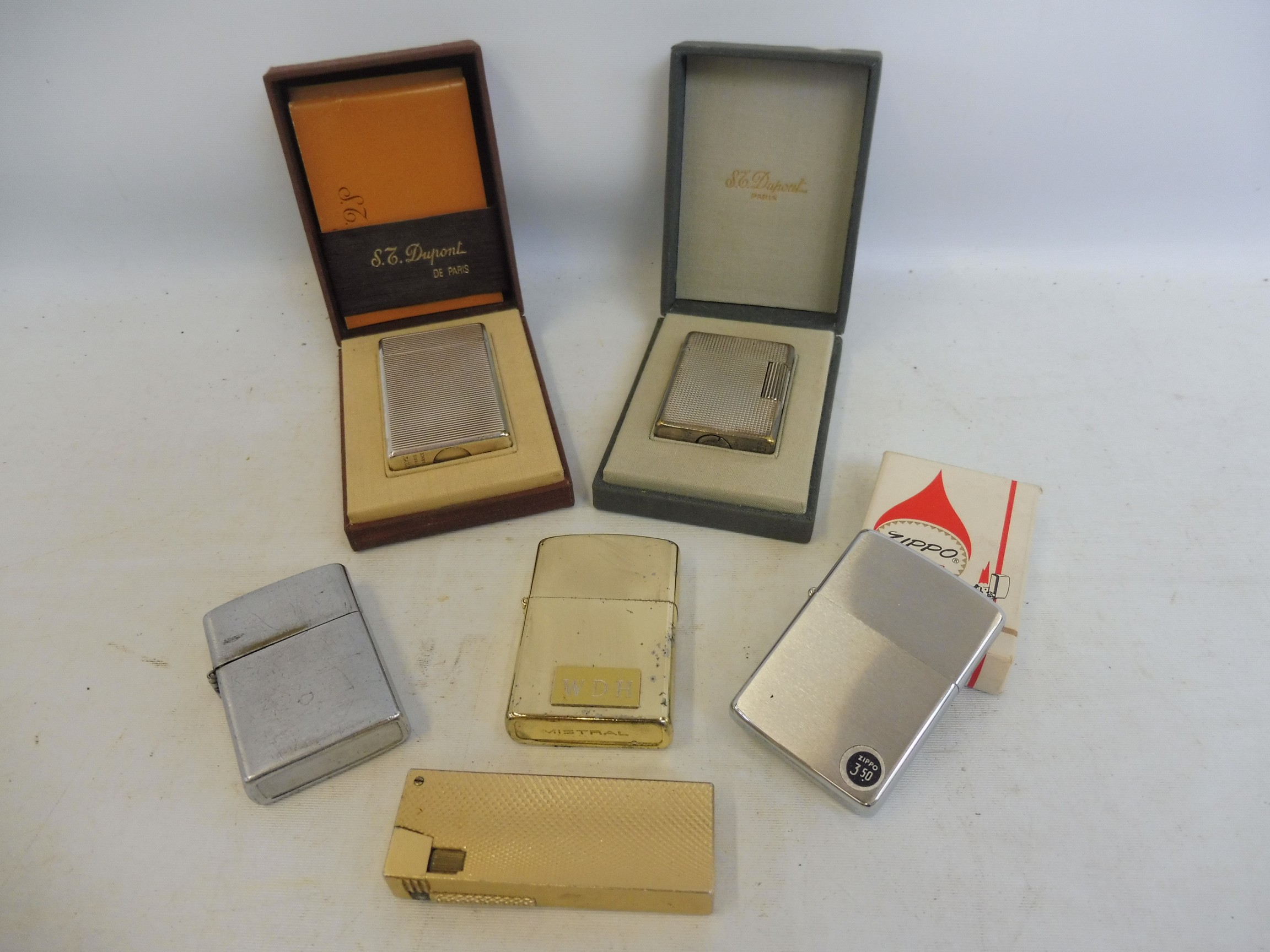 A selection of assorted Zippo and Dupont lighters etc.