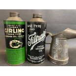 A Wakefield Girling cylindrical quart can, a Filtrate quart can and a Redex measure.