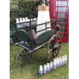 A Victorian dairy delivery pram, in good condition having been repainted 15 years ago. It includes