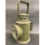 A Bladon military issue hand held railway lamp, dated 1954.