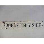 A narrow enamel sign bearing the words 'Queue This Side', possibly railway or bus related, 15 x 2