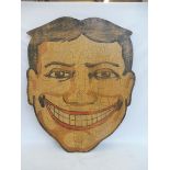 A Folk Art large scale artwork study of a smiling face, on wood, 32 x 38".