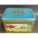 A Primus Stove in a brightly coloured tin, to the front showing a 1950s/1960s picnic scene beside