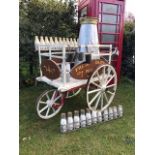 A Victorian diary delivery pram in good condition, having been repainted 30 years ago. It has a