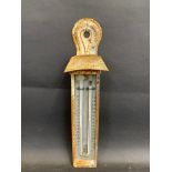 A white painted outdoor hanging thermometer, 11" tall.