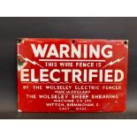A Warning 'Electrified wire fence' by the Wolseley Electric Fences small enamel sign, 9 x 6".