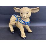 A Lamtex Rugs shop window advertising figure of a lamb, 10" tall.