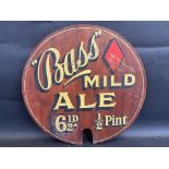 A Bass Mild Ale circular wooden sign, 17" diameter.
