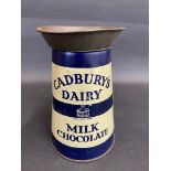 A Cadbury's Dairy milk Chocolate tin in the shape of a milk churn, 5 3/4" tall.