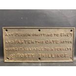 A cast iron gate sign detailing a penalty of forty shillings for failing to shut it, 16 3/4 x 8 1/