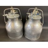 Two milk churns.