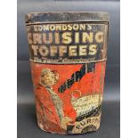 An early oval tin for Edmonson's Cruising Toffees depicting a lady stood beside a steam ship, 11"