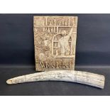 A well-detailed resin plaque bearing the words 'White Label', 11 1/2 x 16", plus a reproduction tusk