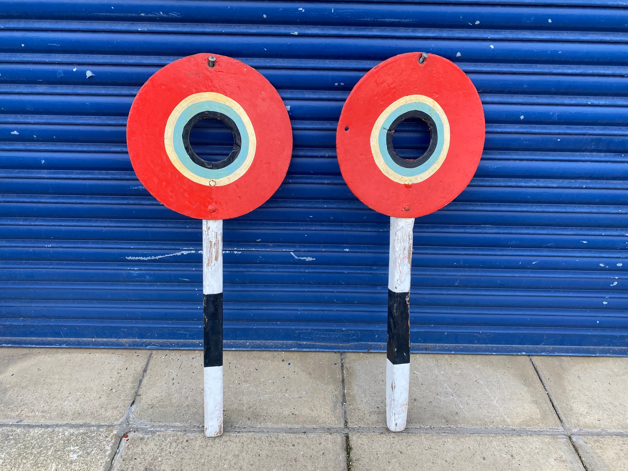 Two fairground hand painted shooting targets.