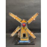 A Meccano shop window advertising windmill, electrified with bulbs.
