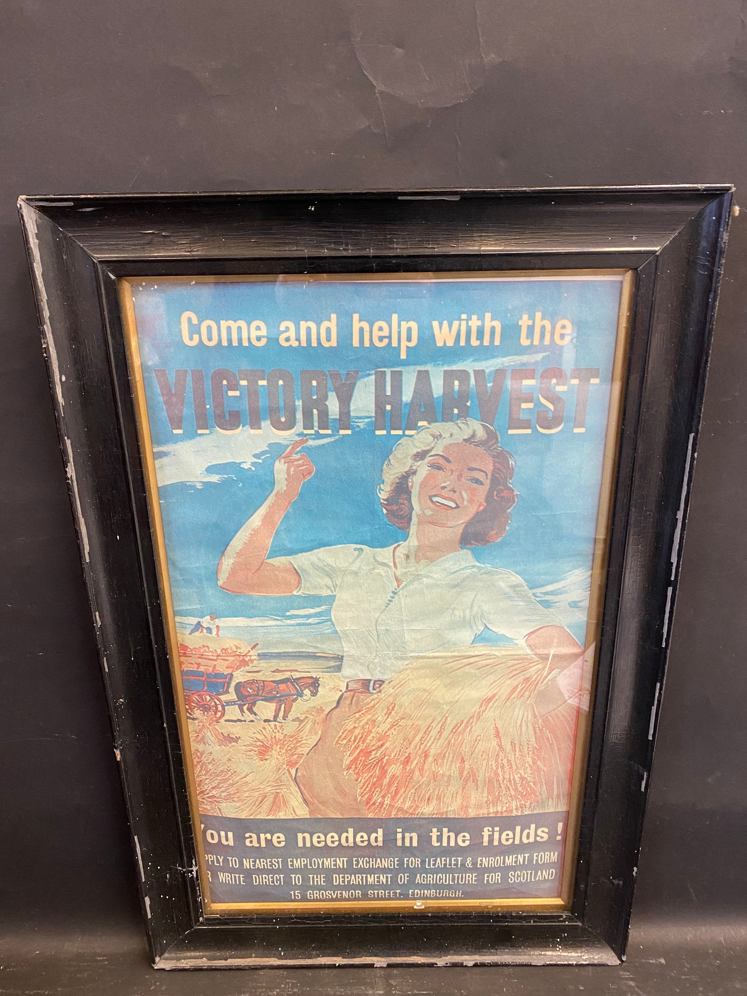 A framed and glazed war-time or just post-war advertisement calling for help with the 'Victory