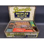 A Bassett's Peoples Mints rectangular tin, with assorted packaging contents.