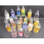 22 early glass milk bottles all with advertising on, including Milky Way, Nescafe etc.