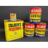 Three large Bird's Custard Powder tins with paper labels, a large Colman's Mustard square tin and
