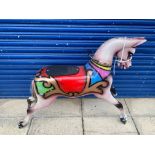 A circa 1950s fairground galloping horse with a broken foot, still present.