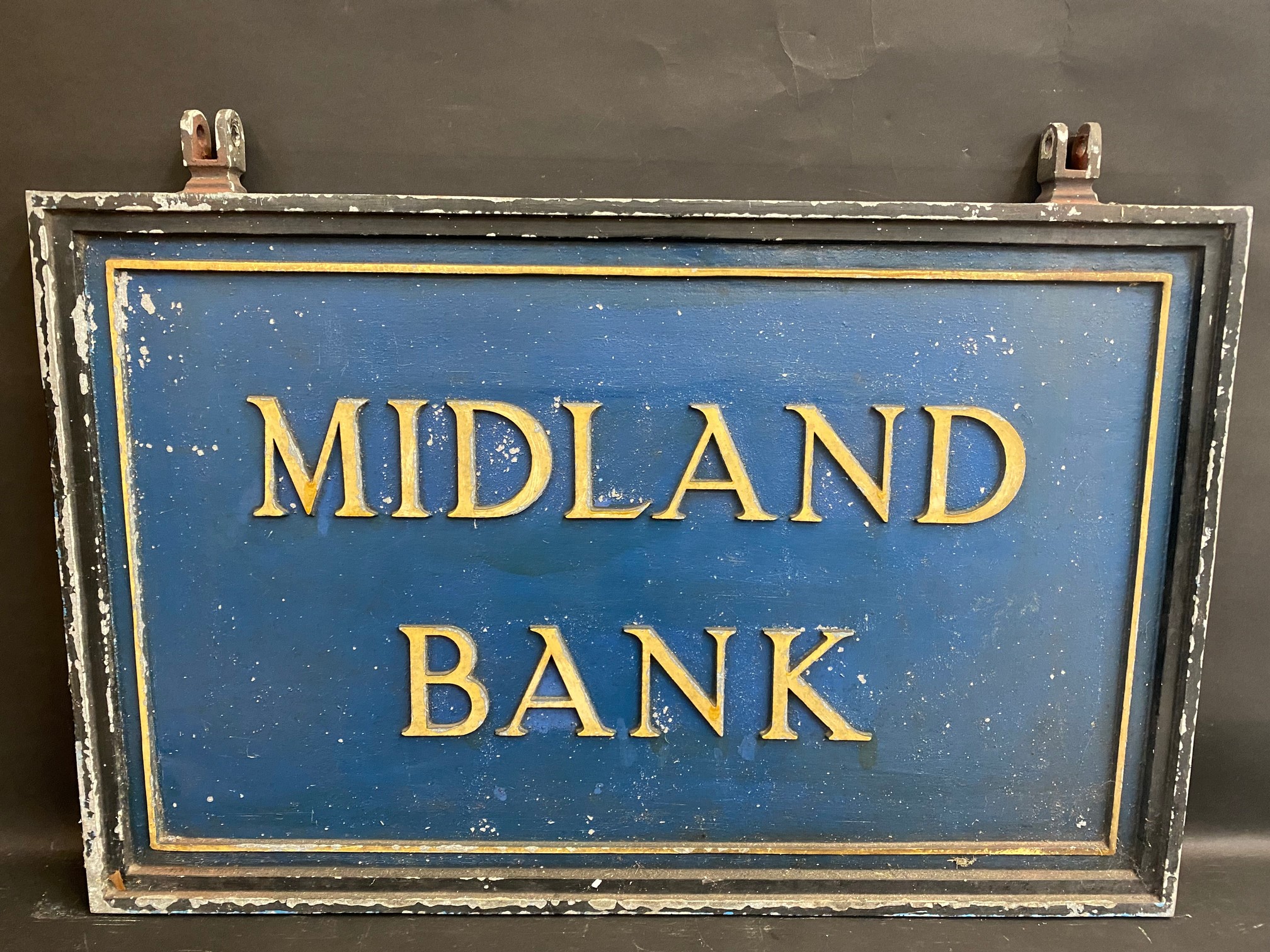 A large cast metal double sided Midland Bank hanging sign, 36 x 25 1/2" including hanging lugs.