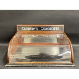 A Cadbury's Chocolate counter top dispensing cabinet of good small size with glass